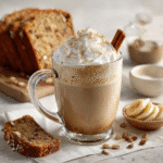 Served banana bread latte with cinnamon stick