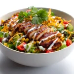 BBQ chicken salad recipe served with avocado corn beans and tortilla strips